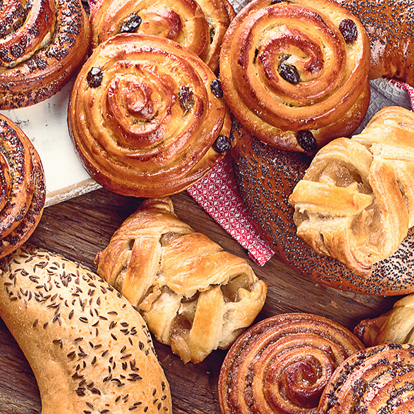 Baked goods piled on a wooden background